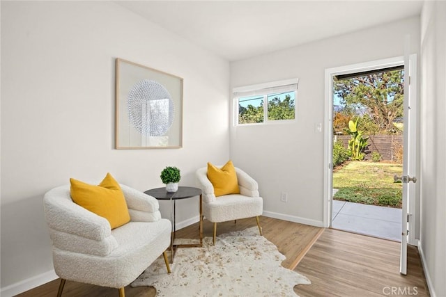 sitting room featuring hardwood / wood-style floors