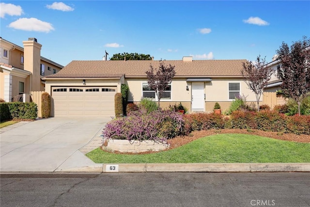 single story home featuring a garage and a front yard