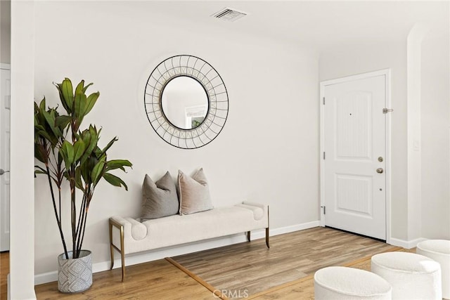 living area with hardwood / wood-style floors