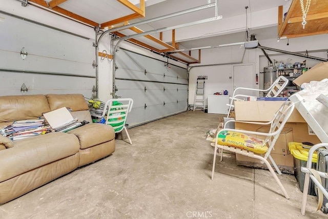 garage featuring secured water heater and a garage door opener