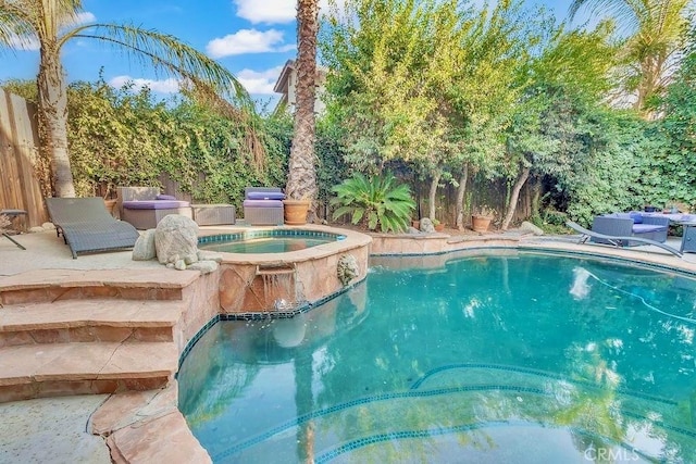 view of pool featuring an in ground hot tub