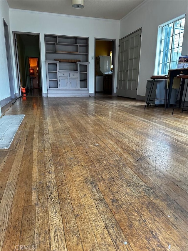 4943 Granada St, Los Angeles, CA 90042 - living room with crown molding, wood-type flooring, and built in features