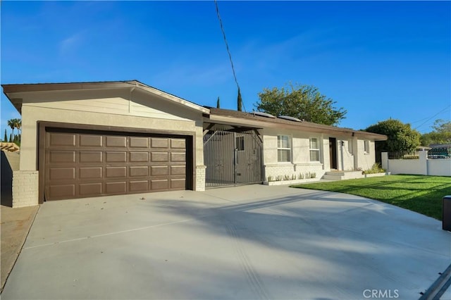 single story home with a garage and a front yard