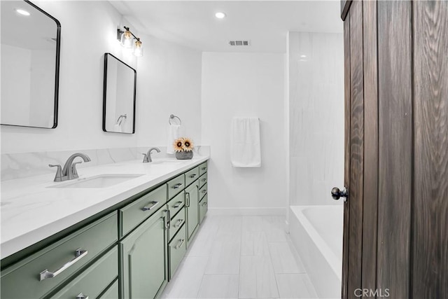 bathroom with vanity and shower / bathtub combination