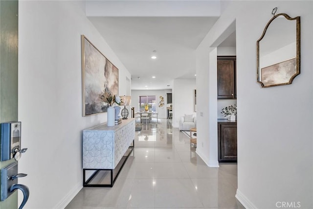 hall with light tile patterned flooring