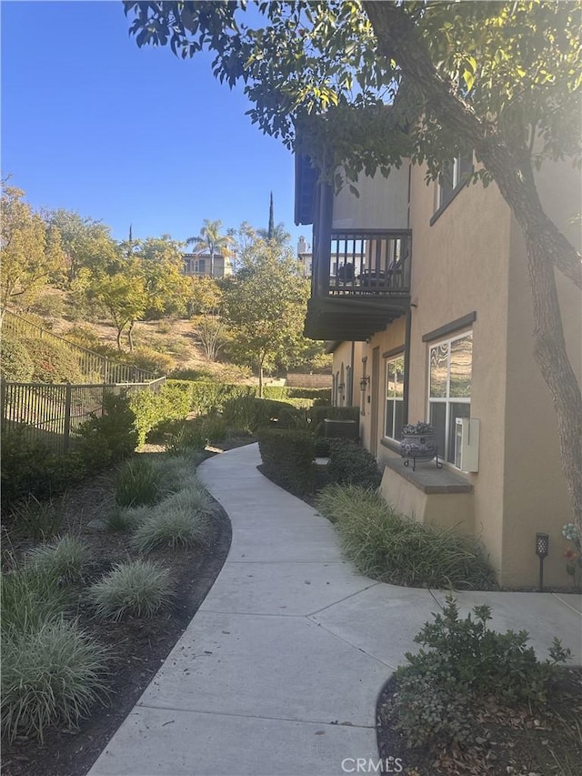 view of yard with a balcony