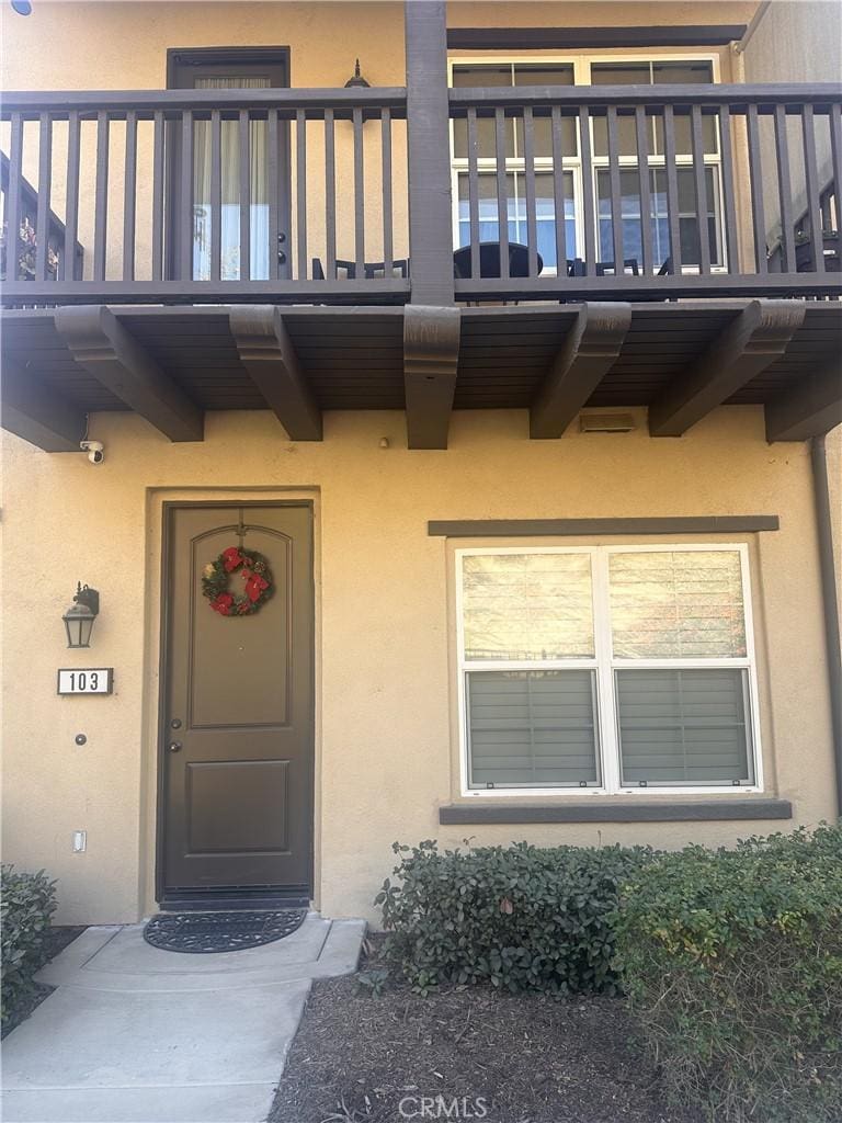 doorway to property with a balcony