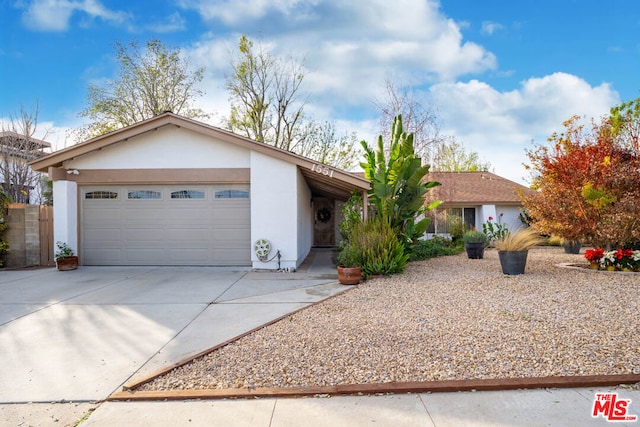 ranch-style house featuring a garage