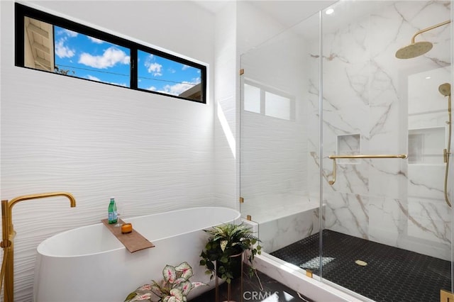 bathroom with separate shower and tub