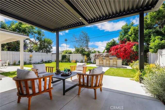 view of patio / terrace with an outdoor hangout area and a bar