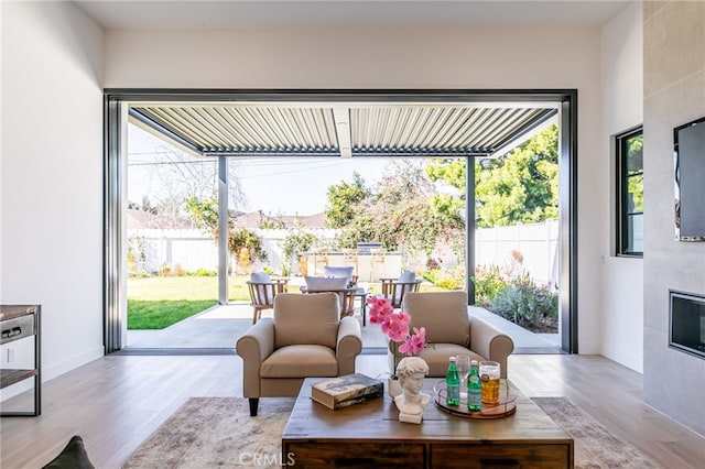 sunroom featuring a fireplace