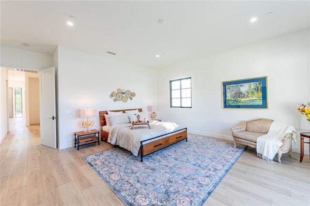 bedroom featuring light hardwood / wood-style floors