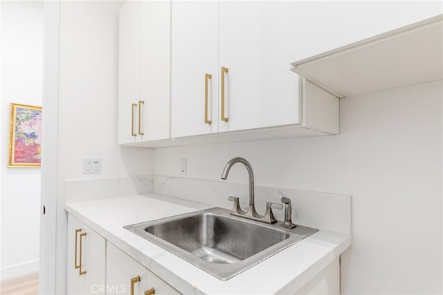 kitchen with sink and white cabinets