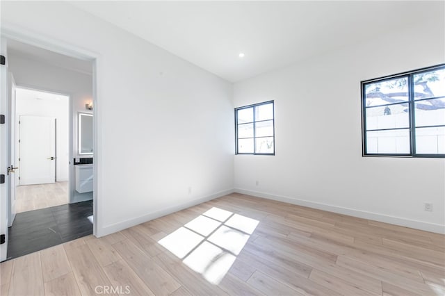 unfurnished room with light hardwood / wood-style floors