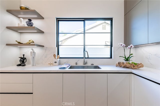 kitchen with backsplash and sink