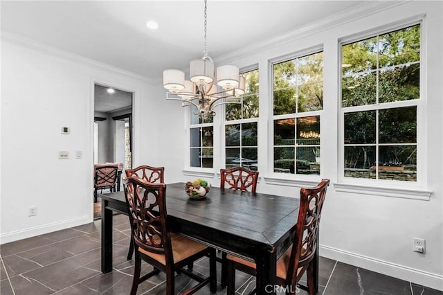 dining area with ornamental molding and a chandelier