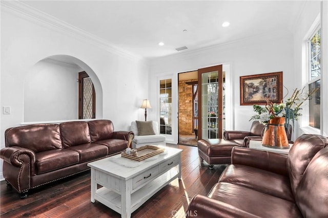 living room with dark hardwood / wood-style flooring and ornamental molding