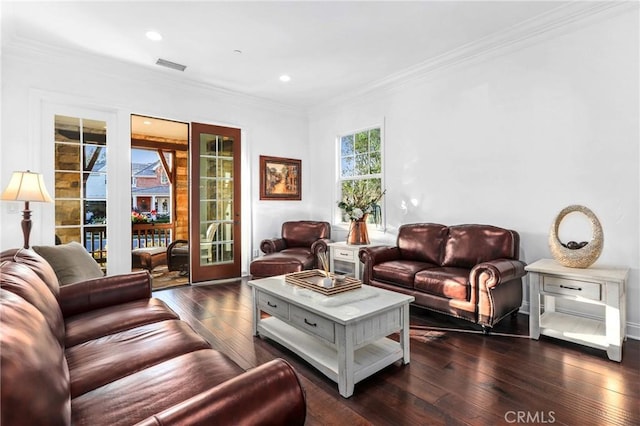 living room featuring dark hardwood / wood-style flooring and crown molding