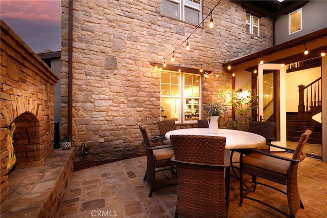 view of patio terrace at dusk