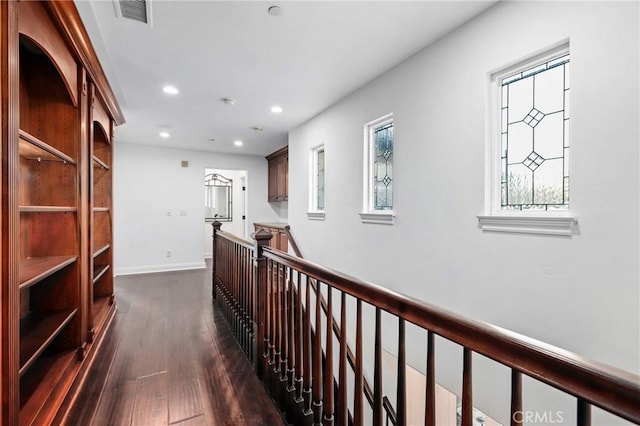 corridor with dark hardwood / wood-style floors