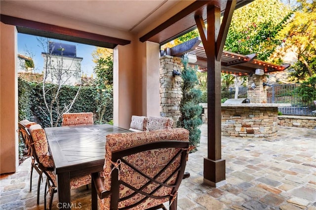 view of patio with exterior kitchen and exterior bar