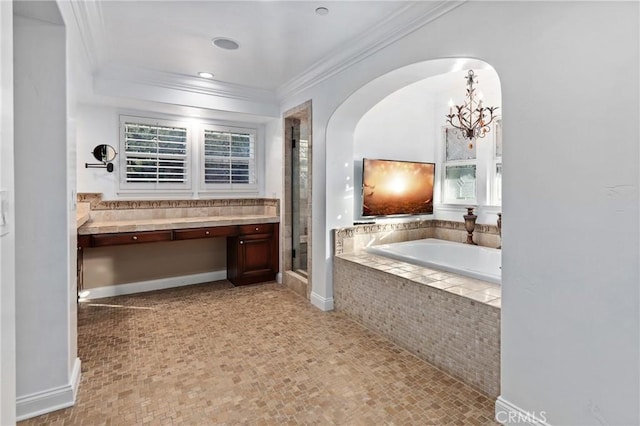 bathroom with an inviting chandelier, crown molding, and plus walk in shower