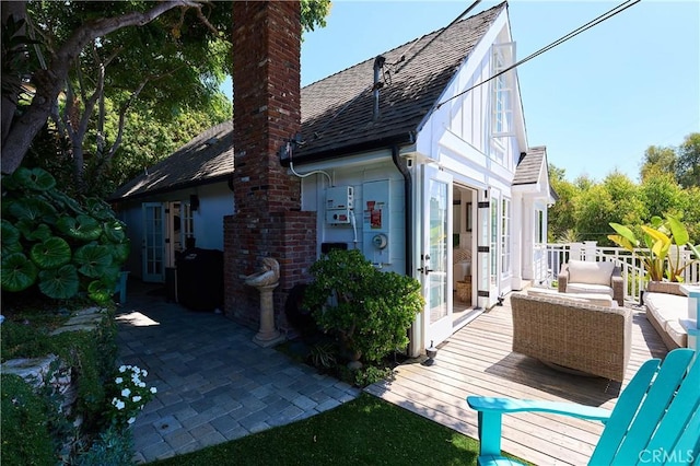 rear view of house with an outdoor living space