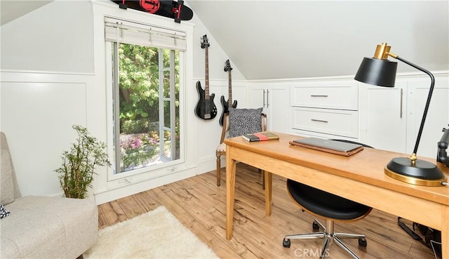 office space with light hardwood / wood-style floors and lofted ceiling