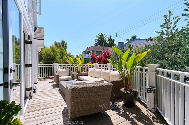 deck featuring outdoor lounge area