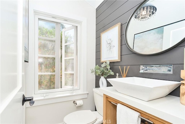 bathroom featuring toilet and vanity