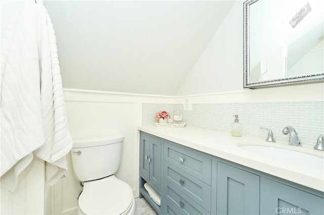 bathroom featuring toilet and vanity