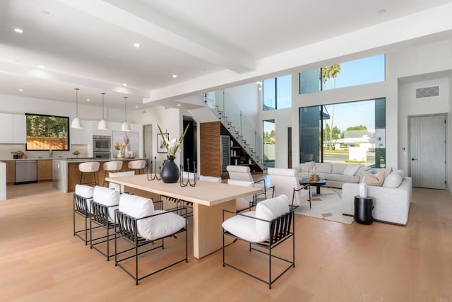 kitchen with stainless steel appliances, a large island, and a breakfast bar area