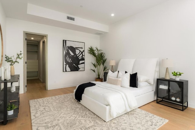 bedroom with light hardwood / wood-style floors