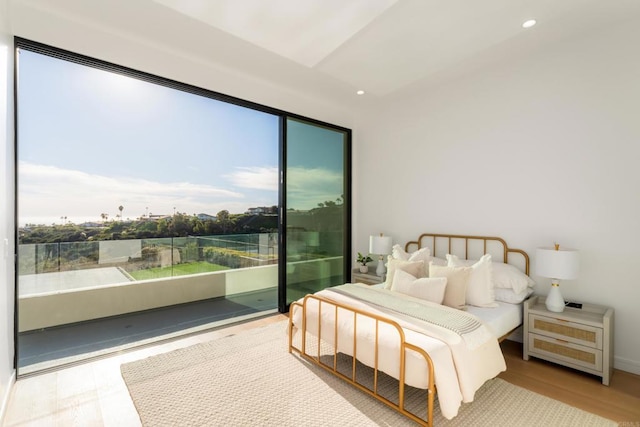 bedroom featuring access to outside and wood-type flooring