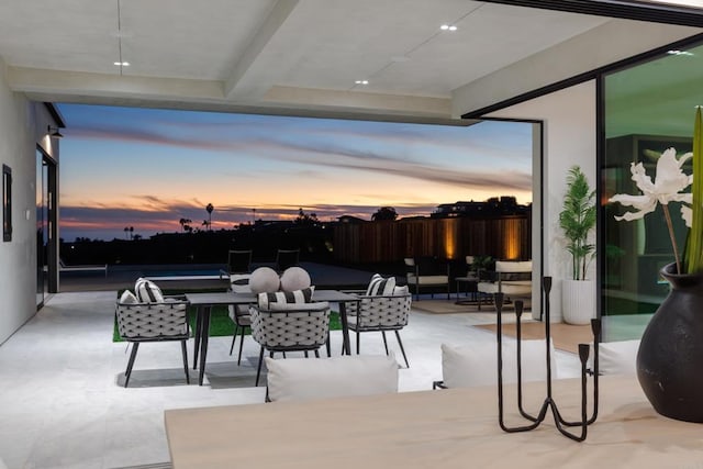 view of patio terrace at dusk