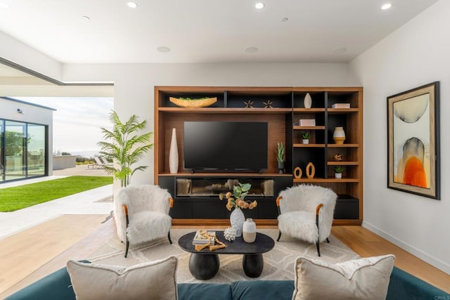 sitting room with light hardwood / wood-style flooring