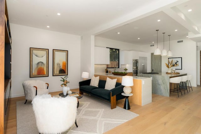 living room with light hardwood / wood-style flooring