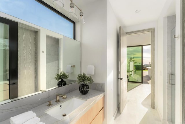 bathroom with tile patterned flooring and vanity