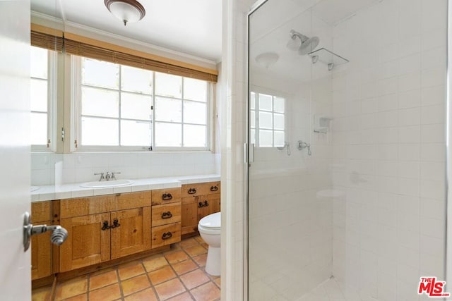 bathroom featuring toilet, a shower with door, backsplash, ornamental molding, and vanity