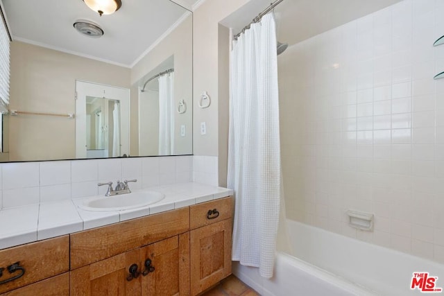 bathroom featuring shower / tub combo with curtain, tasteful backsplash, tile patterned floors, crown molding, and vanity