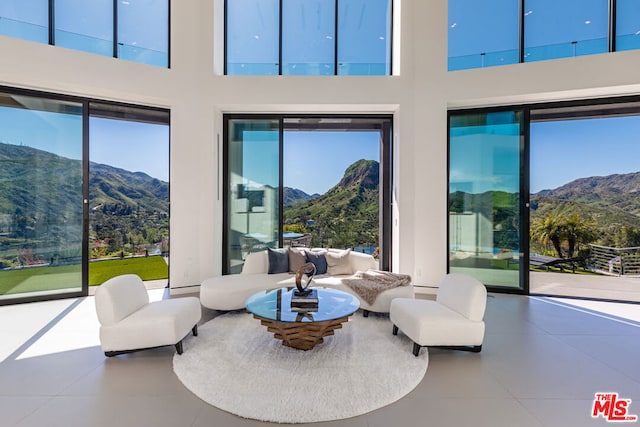 interior space with a mountain view and a towering ceiling