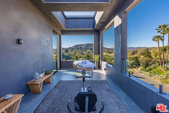 view of patio / terrace with a mountain view