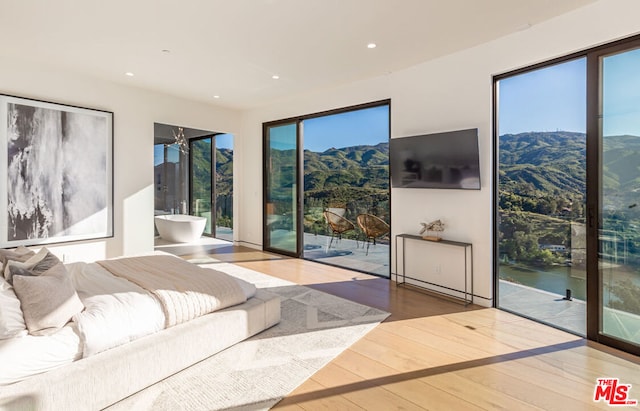 living room with a healthy amount of sunlight and wood-type flooring