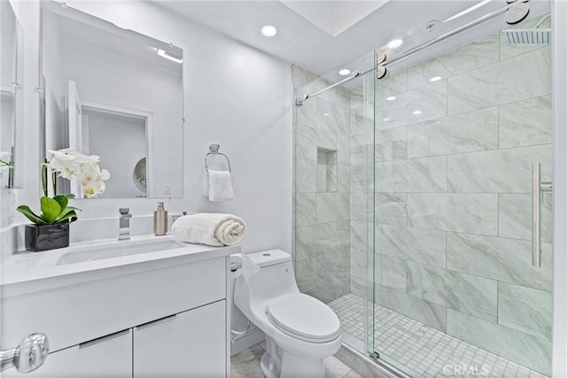 bathroom with toilet, an enclosed shower, and vanity