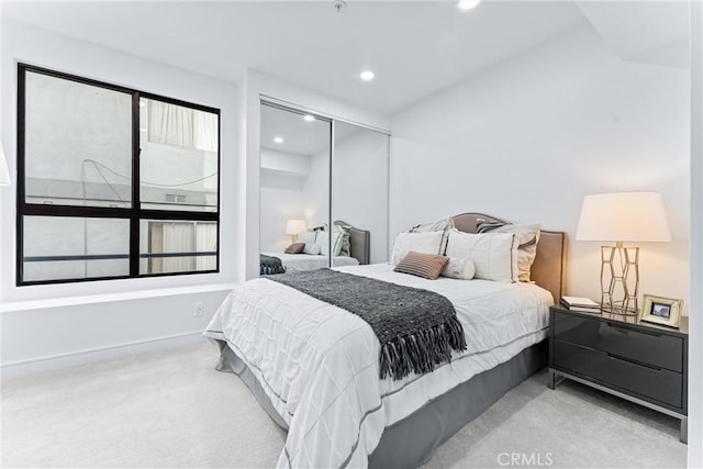 carpeted bedroom featuring a closet