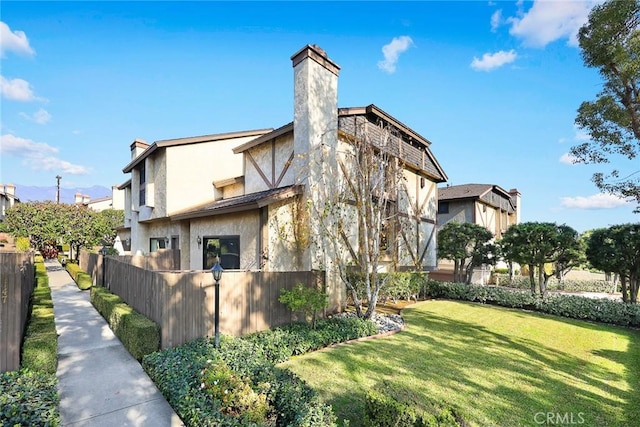 view of property exterior with a lawn