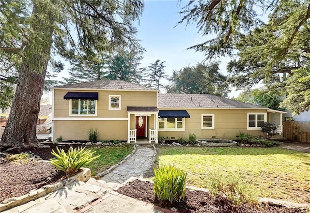 single story home featuring a front lawn