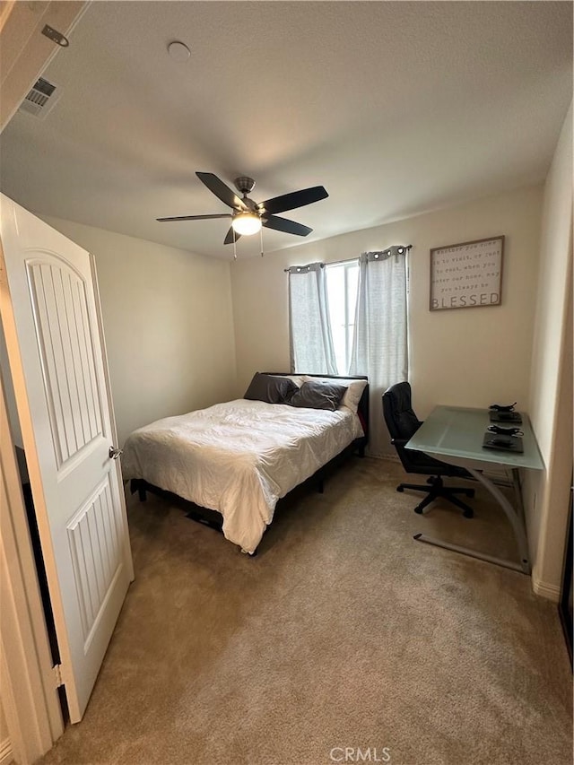 carpeted bedroom with ceiling fan