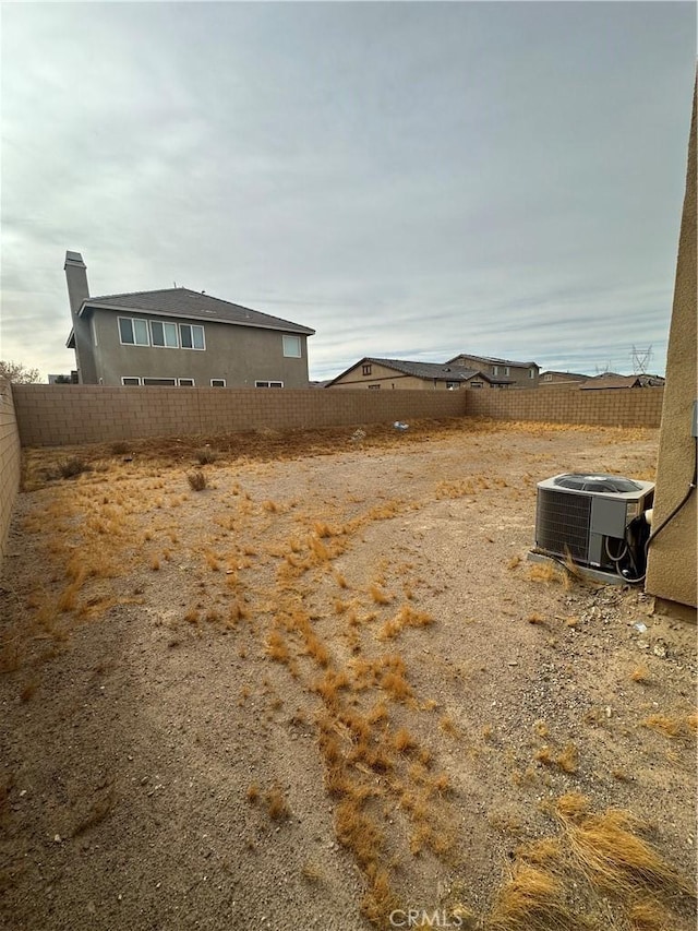 view of yard with central air condition unit