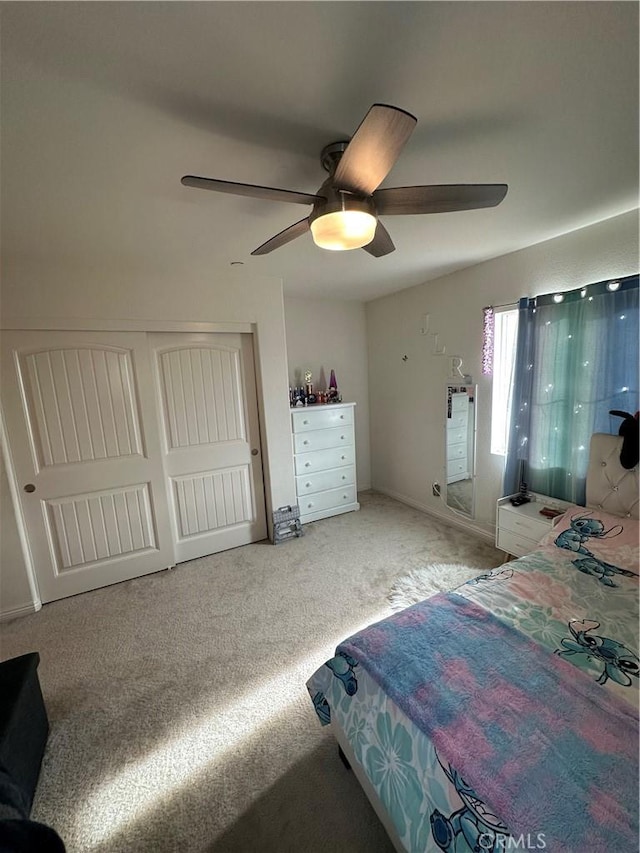 carpeted bedroom featuring ceiling fan